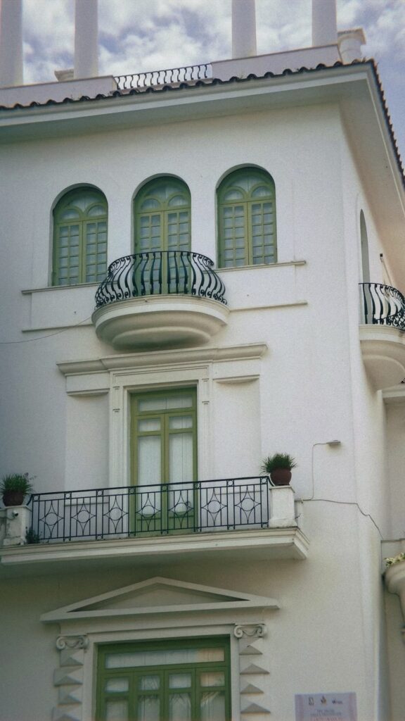 A white and green stucco building in Sorrento, Italy.